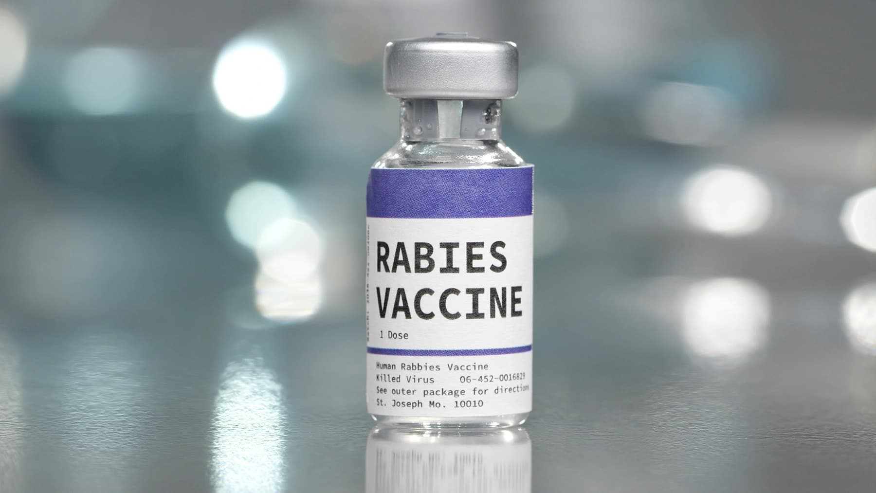 Pharmacist administering a rabies vaccine injection to a patient's upper arm in a clinical setting.